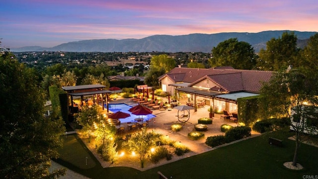 aerial view at dusk with a mountain view