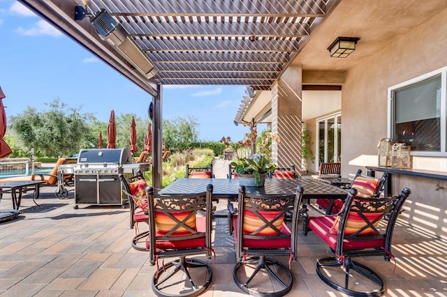 view of patio / terrace featuring area for grilling and a pergola