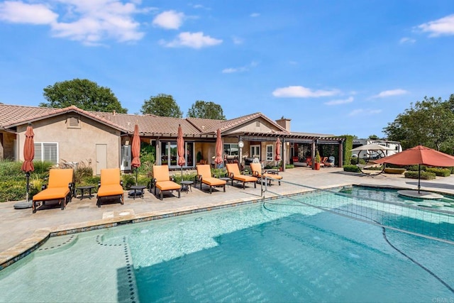 view of swimming pool featuring a pergola and a patio