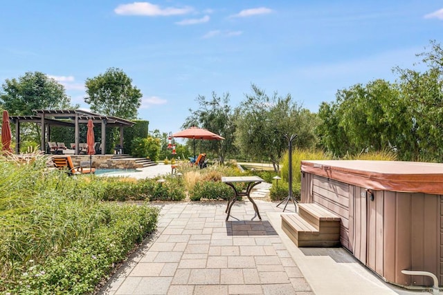 view of patio / terrace featuring a pergola and a hot tub