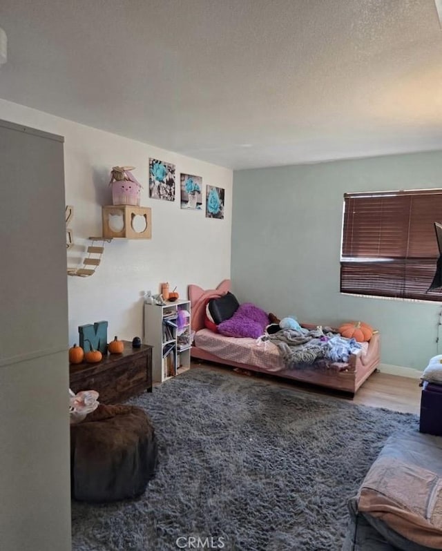 84 Jack Ct, Merced, CA 95341 - bedroom featuring wood finished floors and a textured ceiling