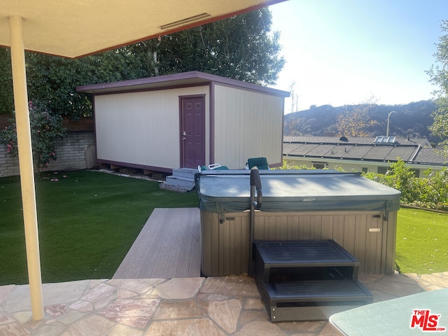 view of patio / terrace with a hot tub