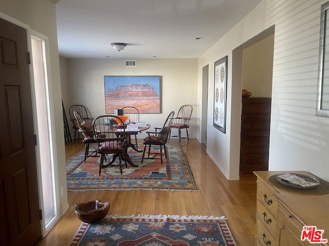 dining room with light hardwood / wood-style flooring