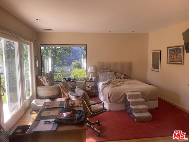 bedroom featuring wood-type flooring