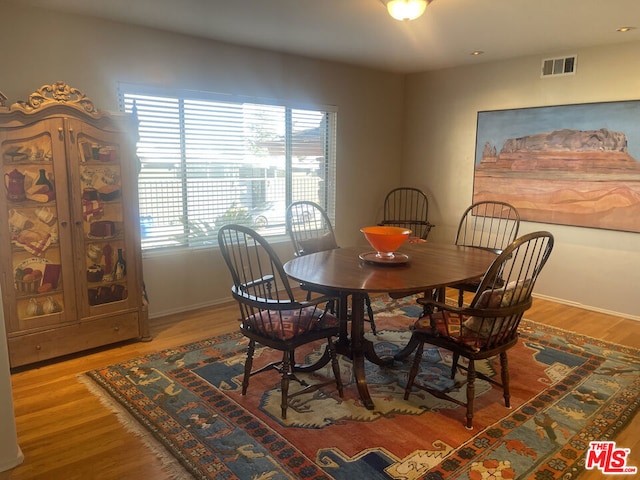 dining room with hardwood / wood-style flooring