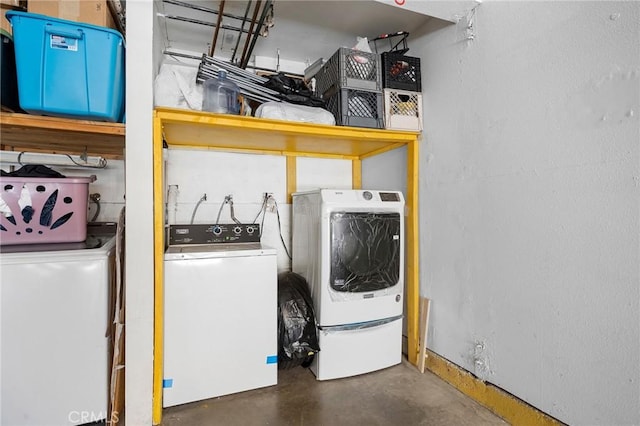 clothes washing area featuring washing machine and clothes dryer