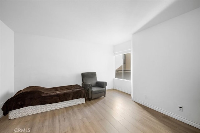 living area with light hardwood / wood-style flooring