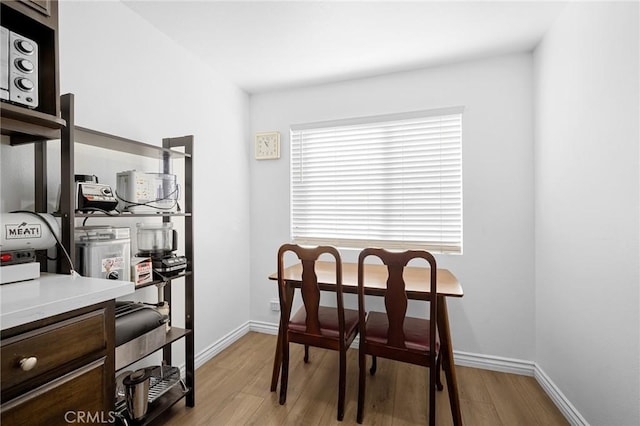 dining room with light wood-type flooring