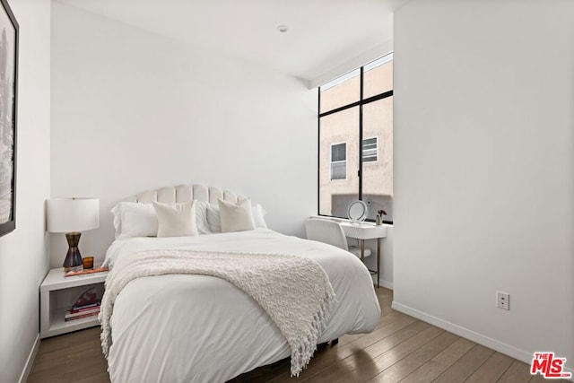 bedroom featuring dark wood-type flooring