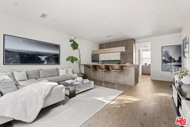 living room with light hardwood / wood-style flooring