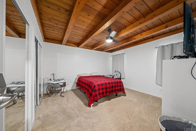 bedroom featuring light carpet, beamed ceiling, wooden ceiling, and ceiling fan