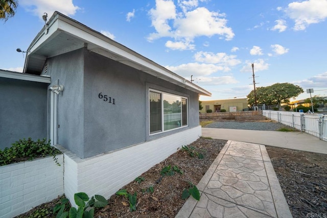 view of side of home featuring a patio area