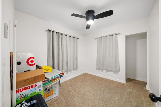 playroom with ceiling fan and carpet