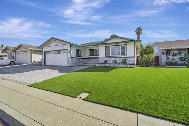 single story home featuring a garage and a front lawn