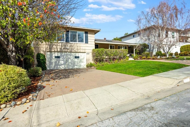 view of front of house featuring a garage and a front yard