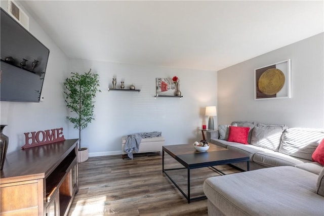 living room featuring dark wood-type flooring