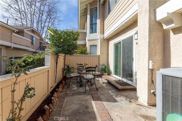 view of patio / terrace with central AC unit