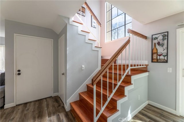 stairs with hardwood / wood-style flooring