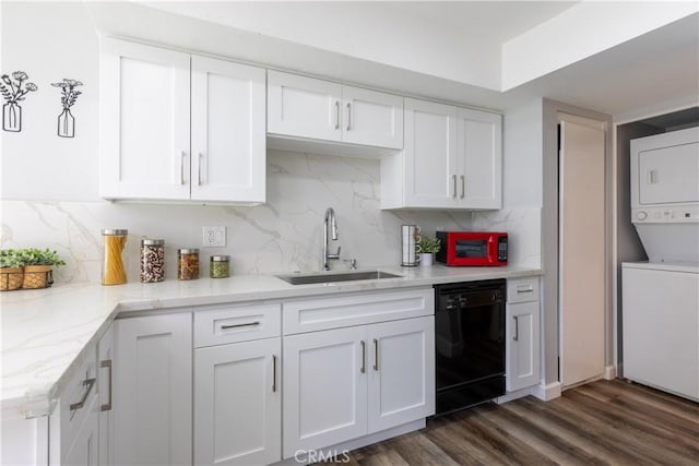 kitchen with stacked washer and dryer, sink, dishwasher, white cabinets, and decorative backsplash