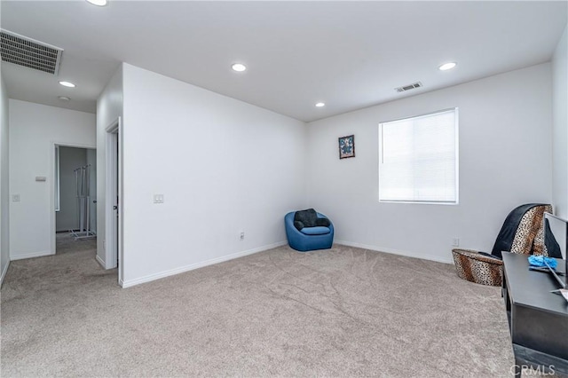 unfurnished room with light colored carpet