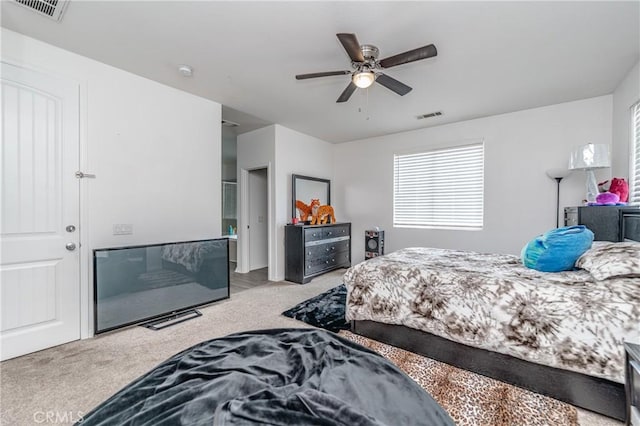 bedroom featuring ceiling fan and light carpet