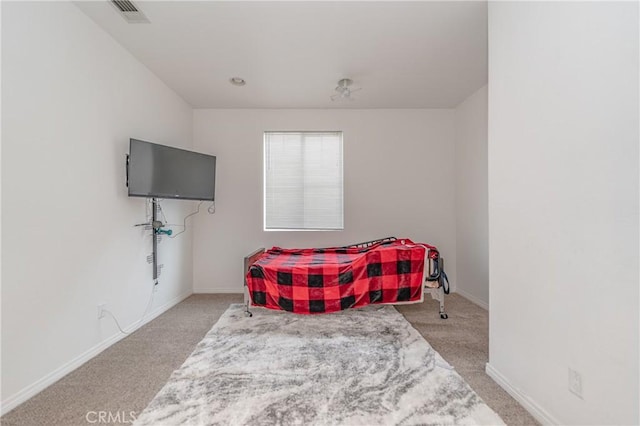 bedroom featuring light colored carpet