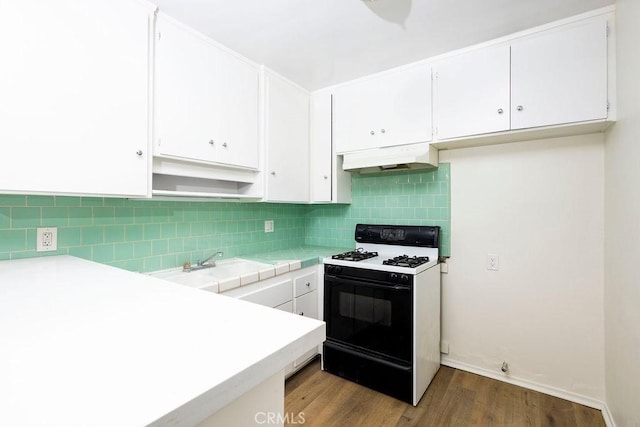 kitchen featuring sink, light hardwood / wood-style floors, gas stove, and white cabinets