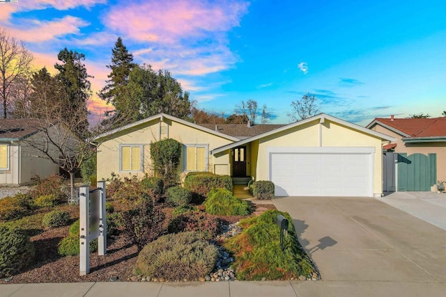 ranch-style house featuring a garage