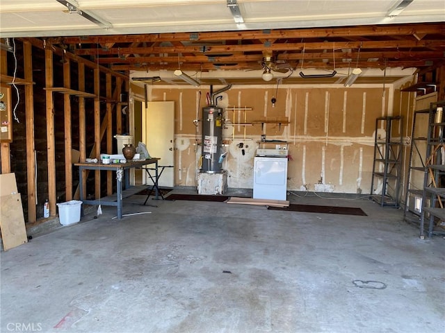 garage featuring washer / clothes dryer and water heater