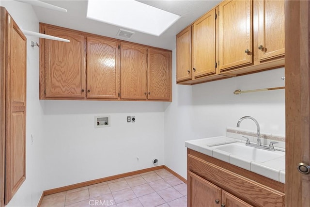 clothes washing area with light tile patterned flooring, sink, cabinets, hookup for a washing machine, and hookup for an electric dryer