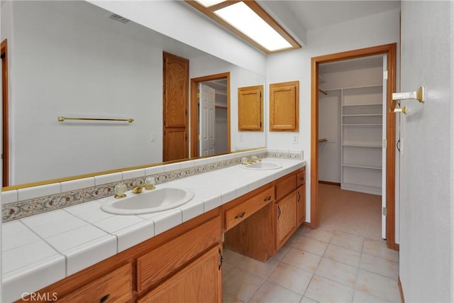 bathroom with vanity and tile patterned floors