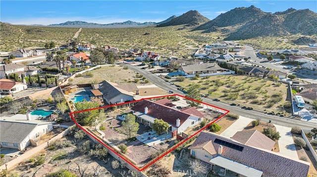 birds eye view of property featuring a mountain view