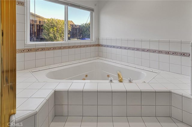 bathroom featuring tiled bath