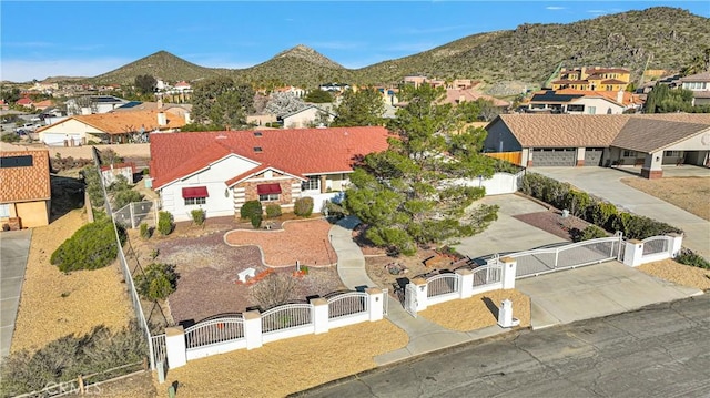 birds eye view of property featuring a mountain view