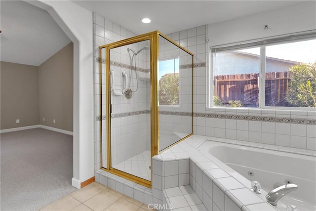 bathroom with tile patterned floors and separate shower and tub