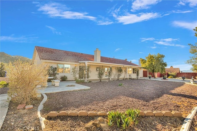 rear view of house with a patio