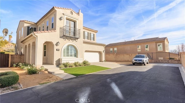 view of front of house with a garage and a balcony