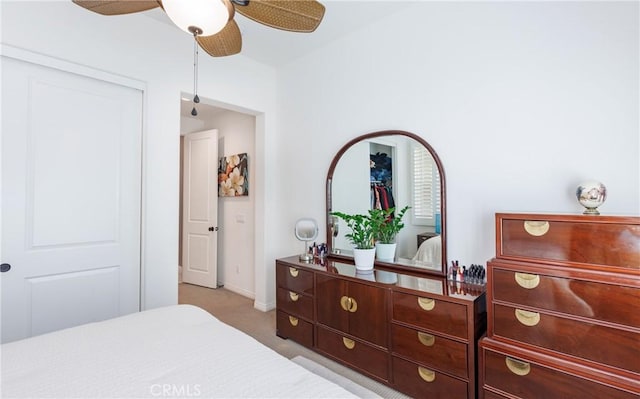 bedroom with light carpet and ceiling fan