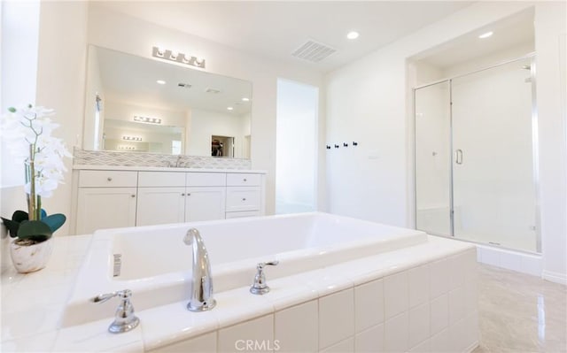 bathroom with vanity and plus walk in shower