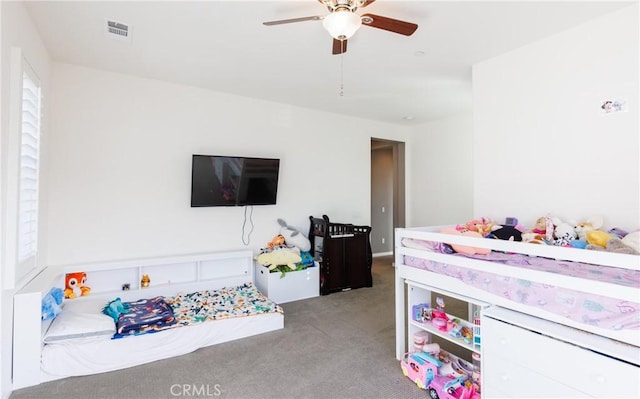 carpeted bedroom featuring ceiling fan