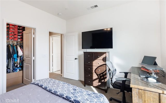 carpeted bedroom featuring a closet