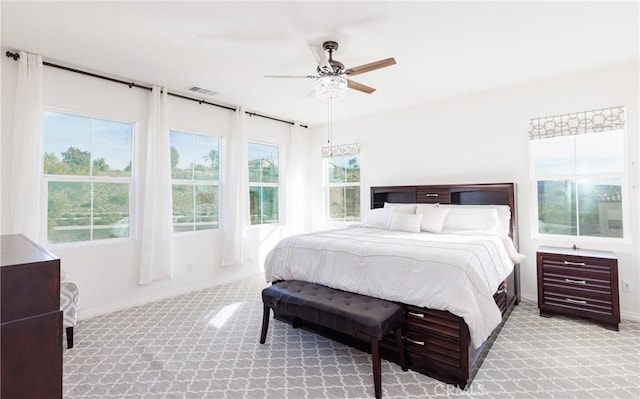 bedroom with light colored carpet and ceiling fan