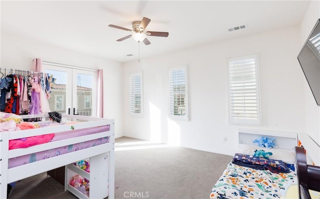 carpeted bedroom with ceiling fan