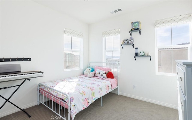 bedroom featuring light carpet