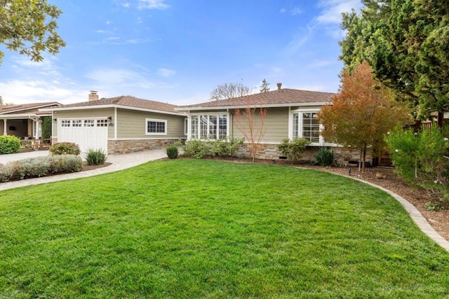 single story home with a garage and a front yard