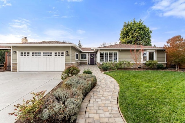 single story home with a garage and a front lawn