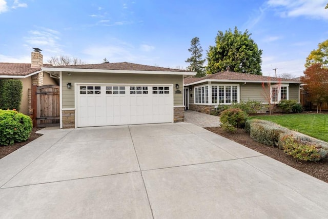 ranch-style house featuring a garage