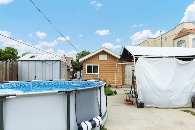 view of swimming pool featuring a storage unit