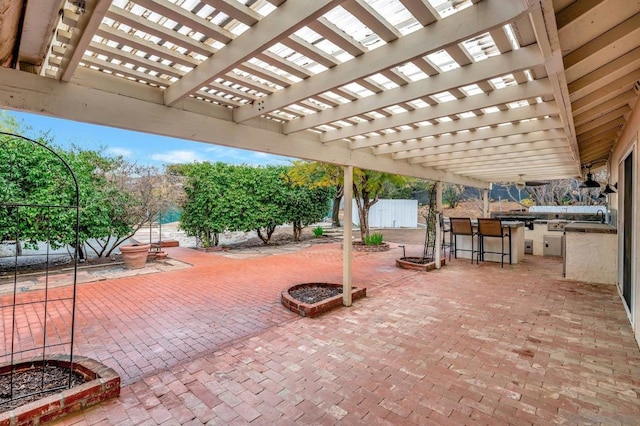 view of patio / terrace with a pergola and an outdoor wet bar