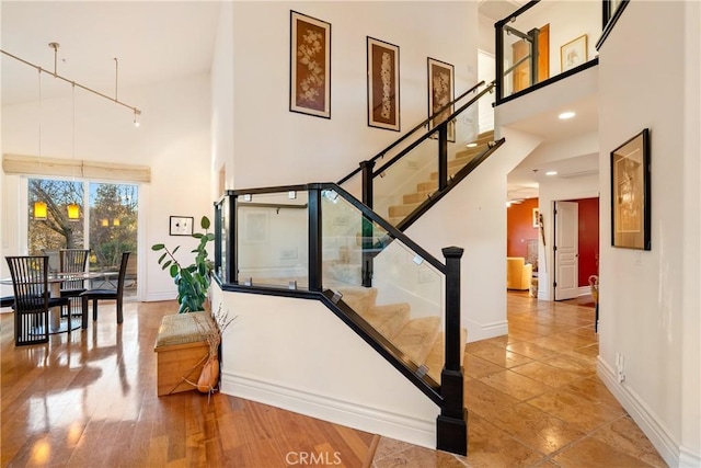 stairway with a towering ceiling